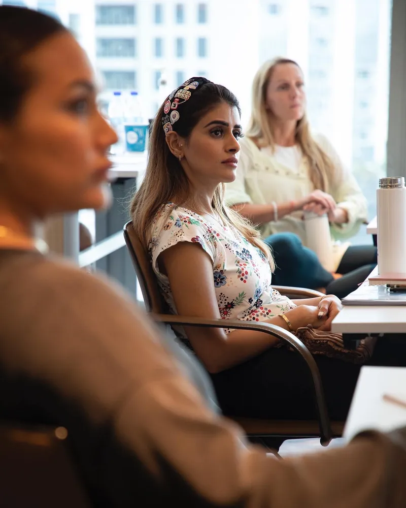 A participant listening during a seminar